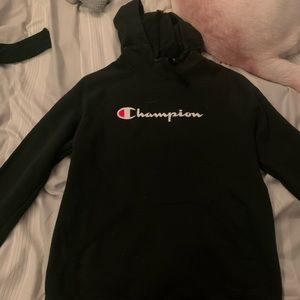 Athletic black champion hoodie.